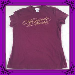 Aeropostale since 1987 in gold on magenta tee